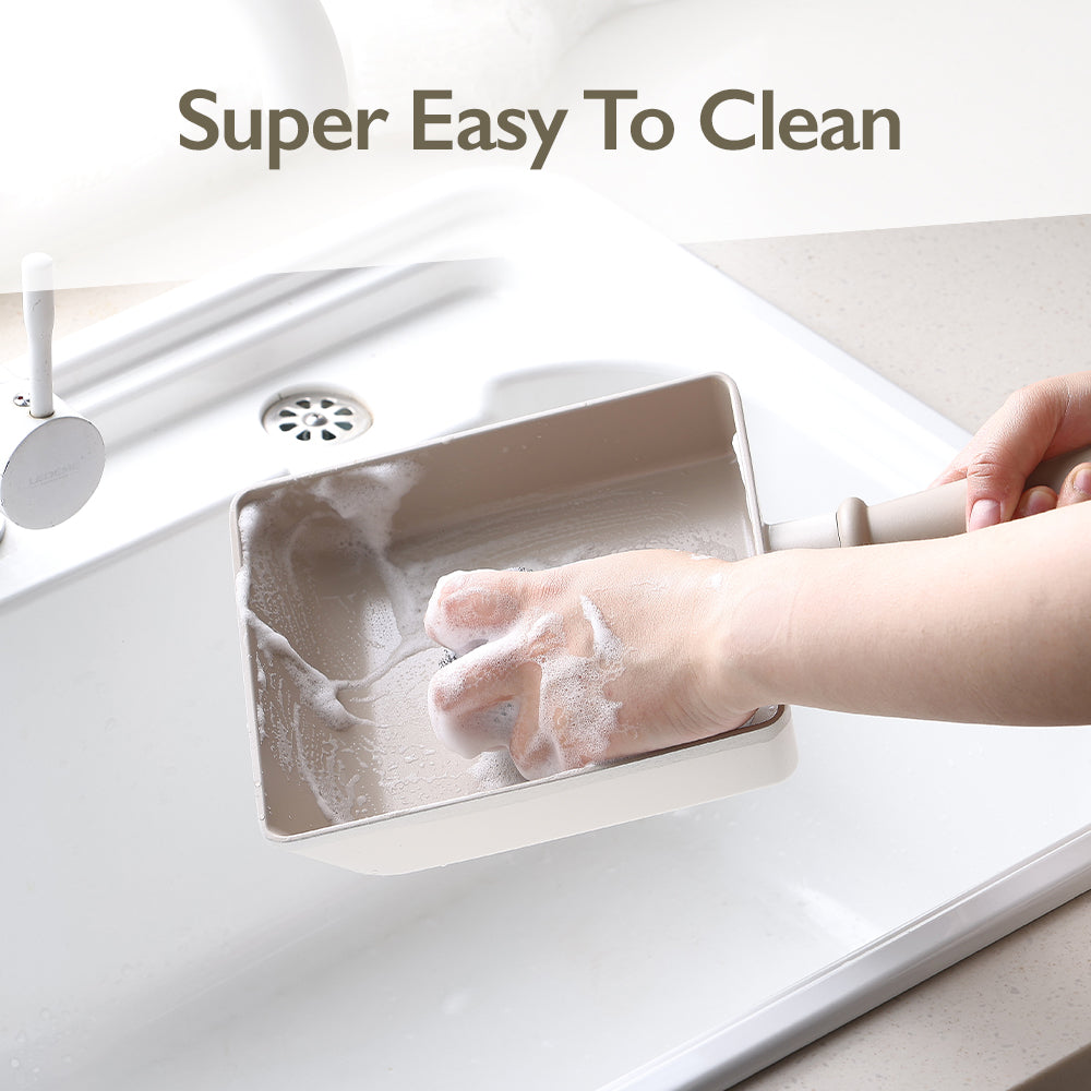 Chou Chou omelet pan being cleaned under running water with soft sponge – easy to clean