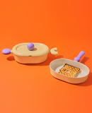 Bright orange setup showcasing the casserole with lid – colorful and modern kitchen vibe