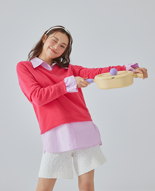 Model holding Better Finger 10" Casserole with smile – portable and giftable kitchenware